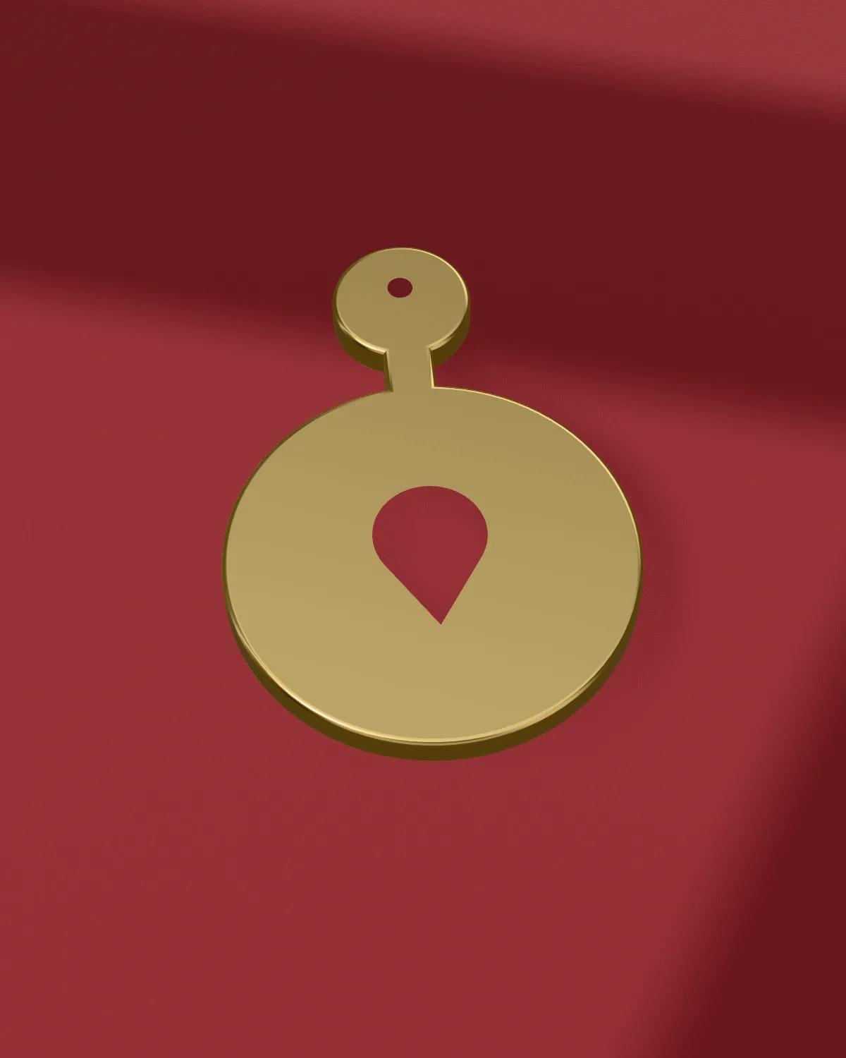 Brass drop earring laid on velvet, close