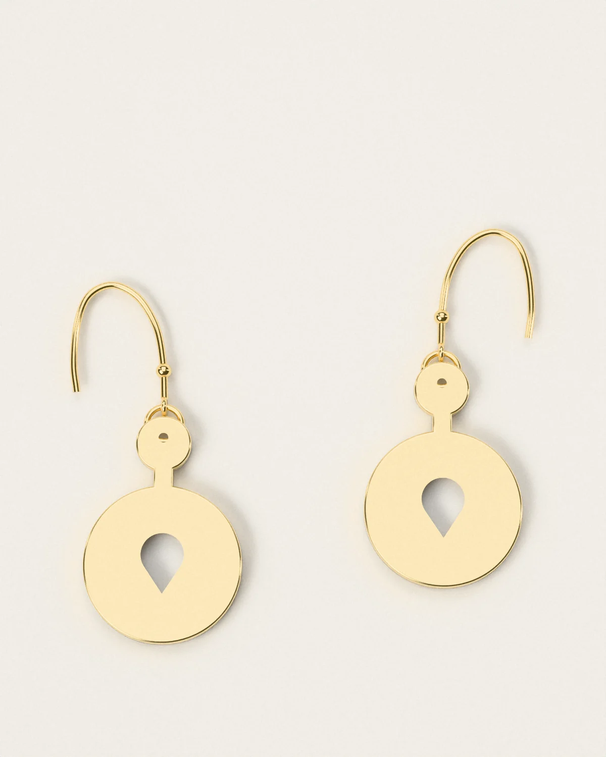 Brass drop earrings, a pair laid flat