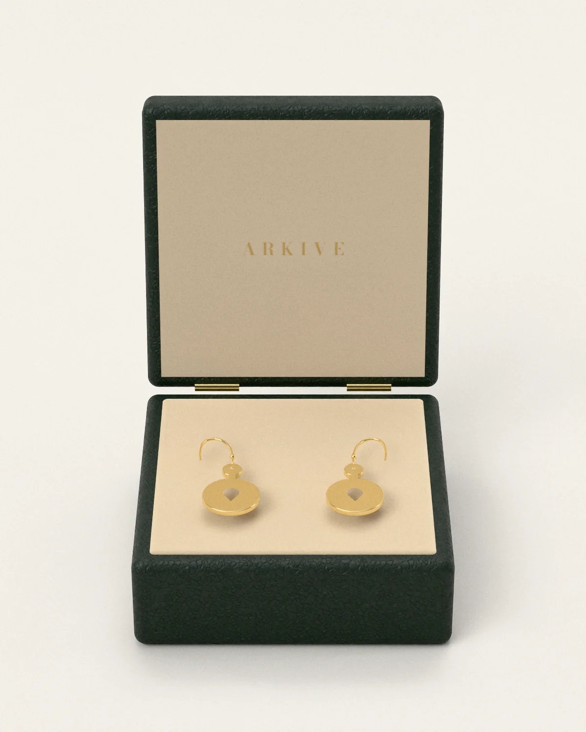 Brass drop earrings in the Arkive case